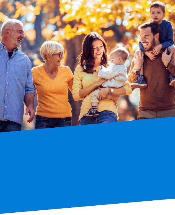 immediate family walking through the trees